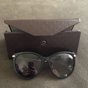 Black and gold Gucci sunglasses